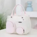 Stylish white and pink canvas handbag featuring multiple external pockets for daily use. - Pink