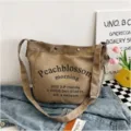 Khaki letter printed canvas shoulder bag, casual large capacity college student tote commuting bag. - L / Coffee