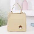 Beige canvas lunch tote bag with cute cartoon girl design, lightweight daily handbag for work. - Khaki