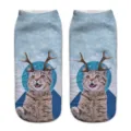 Close-up detail of 3D cat face and reindeer antlers print on soft blue sock fabric. - A241