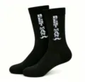 Close-up detail of black crew socks featuring white knitted Best Man text and mustache. - One Size / Best Man