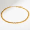 Detailansicht einer goldenen Edelstahl groben Kubakette Halskette mit klarem ovalem Zirkon. - Ovaler Transparenter Zirkonia (B140)