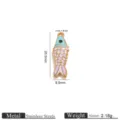 Close-up detail of the gold-plated stainless steel koi fish pendant with colorful enamel scales. - Light Blue Purple and White