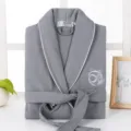 Grey cotton waffle bathrobe detail showing soft fabric, elegant white piping and tied belt. - M / Robe / Gray
