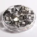 Stainless steel cookie cutter set with various animal and geometric shapes in a clear box. - 12PC Geometric Set (13804) / Stainless Steel Primary Color