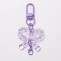 Portachiavi con fiocco in acrilico viola trasparente e moschettone in metallo per fai da te. - Fibbia a Fiocco / Viola