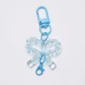 Portachiavi con fiocco in acrilico trasparente e moschettone blu accessorio borsa DIY. - Fibbia a Fiocco / Blu