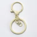 Beige metal keychain hardware set, lobster clasp and split rings for DIY crafts and bag charms. - Beige White