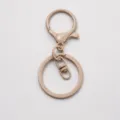 Beige painted keychain hardware set with lobster clasp, jump ring, and split ring for DIY. - Khaki