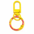 Colorful painted donut spring buckle keychain DIY metal accessory, yellow with pink icing design. - Yellow