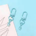 Detail of light blue metal U-shaped swivel keychain clasp with lobster hook for DIY accessories. - Gate Buckle + Lobster Clasp / Light Blue