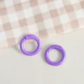 Detailed view of purple zinc alloy spring rings, perfect for DIY keychains and handmade jewelry crafts. - Purple