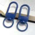 Detailed shot of blue metal U-shaped keychain gate clasp, swivel ring hardware for DIY craft. - Royal Blue Gate Buckle