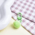 Green fluffy pom pom keychain detail shot, soft faux rabbit fur pendant for bags and keys. - Plush Ball + Clasp / Green