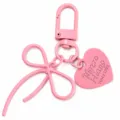 Roze legering strik sleutelhanger met hart hanger, schattige tas charm en handige sleutelring. - Roze