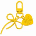 Gele legering holle strik sleutelhanger met hart hanger voor tas accessoire DIY. - Geel