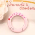 Pink round spring snap hook buckle with good luck letter engraved for DIY jewelry charms. - Light Pink Letter Spring Buckle