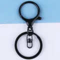 Black metal lobster clasp keychain hardware detail shot, ideal for DIY crafts and accessories. - Black Painted Round Dragon Buckle 3-Piece Set