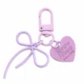 Lichtpaarse legering strik sleutelhanger met hart label, schattig accessoire voor tassen. - Lichtpaars