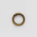 Closeup detail of antique bronze zinc alloy round spring snap hook for DIY bag keyring hardware. - Bronze