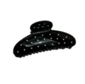 Vista dettagliata di un fermaglio per capelli nero a pois bianchi, elegante accessorio donna. - Nero