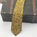 Detailed shot of a gorgeous yellow-green paisley jacquard men's tie with fine yarn-dyed texture. - Hand-Tied Necktie / 145x8cm