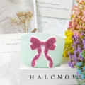 Silicone cup sleeve with pink rhinestone bow accessory detail, perfect for Stanley tumbler. - Pale Green
