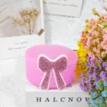 Pink silicone cup boot detail with rhinestone bow accessory for tumblers and cups protective cover. - Pink