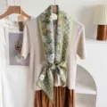 Detailed close-up view of elegant green floral double-layer silk blend ribbon scarf on display. - Light Green Ditsy Floral