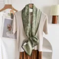 Detailed view of the 2026 autumn winter silk wool blend ribbon neck scarf with marine print. - Light Green Ocean Floral
