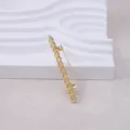 Gold chain brooch detail, elegant metal collar pin close-up for women's suit coat styling. - Gold