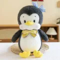 Joli jouet en peluche pingouin avec nœud papillon bleu et jaune, poupée douce cadeau d'enfant. - Manchot / 30cm