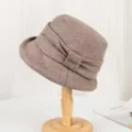 Detailed view of the vintage women's faux wool bucket hat in khaki, showcasing pleated texture. - Adjustable / Camel