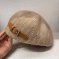 Detail view of the cozy knitted beret with leather strap, warm autumn winter hat style. - Mocha