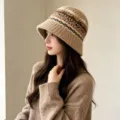 Detailed view of women knitted bucket hat, autumn warm roll-brim design with stylish pattern. - One Size / Khaki Jacquard