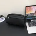Men black leather clutch bag casual minimalist large capacity handheld toiletry bag for commute. - Black