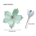 Vista dettagliata del fiore di Natale artificiale verde menta con bordi glitterati. - Verde