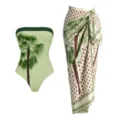 Detailed view of the palm tree print strapless swimsuit and polka dot sarong resort set. - S / Top And Bottom