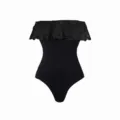 Detailed view of the black strapless one-piece swimsuit featuring an eyelet ruffle overlay. - S / Dresses