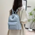 Detailed shot of casual quilted soft leather backpack in light blue, versatile daily wear. - Blue
