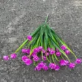 Artificial purple flower bouquet with green leaves, realistic plastic floral decor for indoor outdoor events. - Fuschia