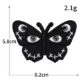 Gotische vlinder geborduurde patch met oogontwerp, stijlvolle DIY stoffen badge voor kleding. - 8.2x5.8cm