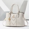 Elegant white PU leather handbag with top handles, geometric pattern and pearl charm. - Off White