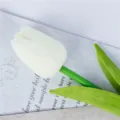 Artificial white tulip flower detail close up shot, realistic green leaf design. - White