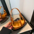 Borsa a mano a mezzaluna arancione lucida, borsa a spalla metallica da donna dettaglio - Arancione