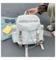Mochila informal de nailon blanco con correas beiges y múltiples bolsillos para viaje - Tostado