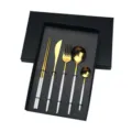 Detail view of Portuguese style stainless steel tableware 5-piece set with gold and white finish. - Platinum