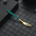 Stainless steel fruit fork with green handle and gold tines, ideal for dessert and cake. - 304 Green