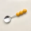 Cuillère à dessert en acier inoxydable avec poignée à trois perles jaunes, 13.5 cm - Cuillères Jaunes