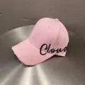 Close-up of pink baseball cap with distressed brim and black Cloud embroidery detail. - Adjustable / Pink